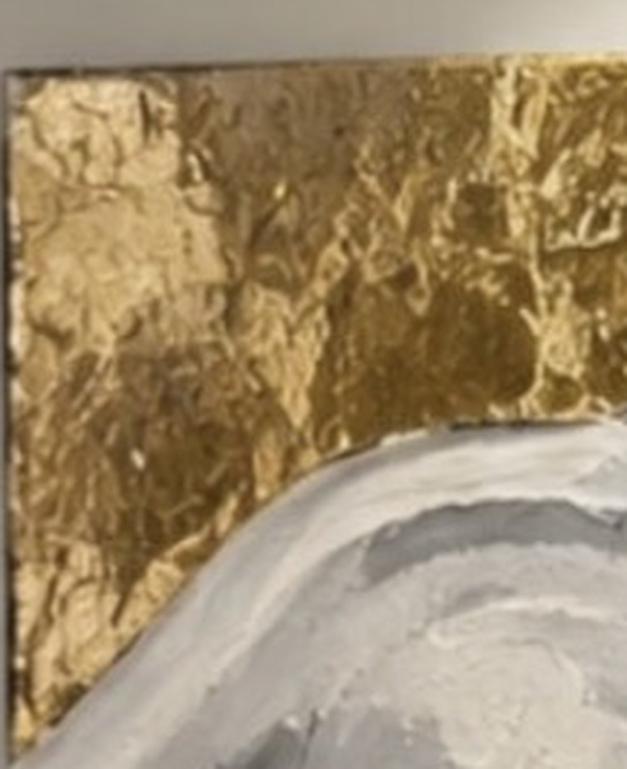 Close detail of hand-applied gold leaf texture