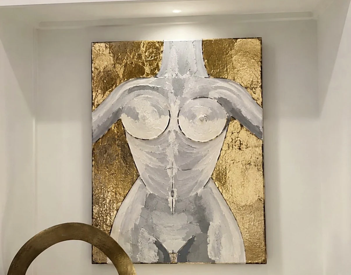 Gilded Form hung in a bright interior niche above a console