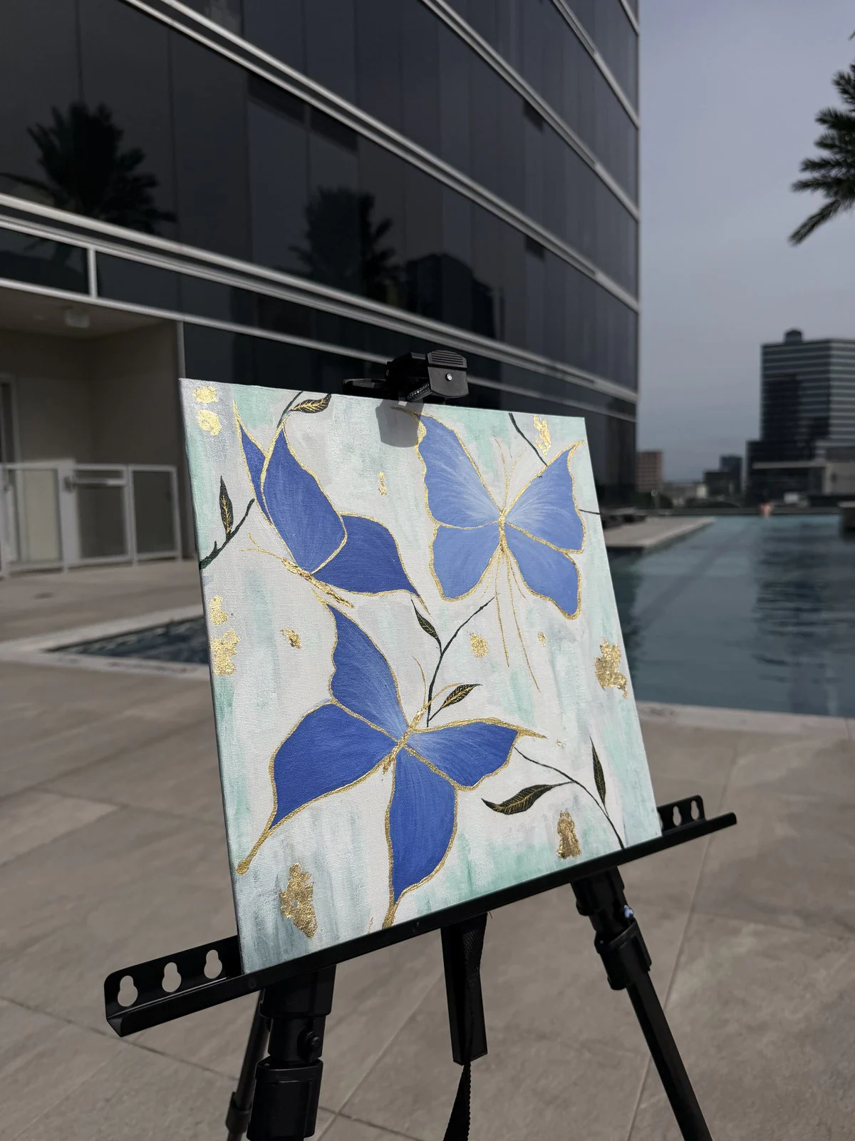 A butterfly piece resting on the easel